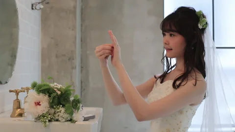 Bride  in dress looking at the ring Stock Footage 161853245