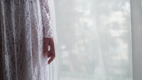 The bride in a dress is standing at Stock Footage 159897650