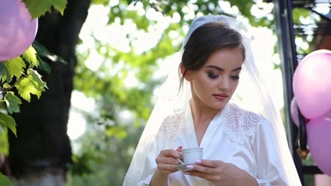 Bride drinking coffee at a wedding day Stock Footage 85280120