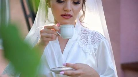 Bride drinking coffee at a wedding day Stock Footage 85280447