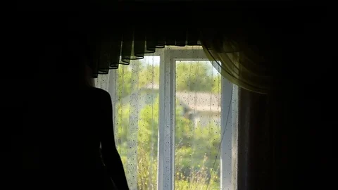 Bride earring near the window Stock Footage 80232272