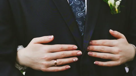 Bride embraces bridegroom . view of the hands of the bride Stock Footage 58029107