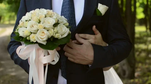 Bride embraces bridegroom . view of the hands of the bride Video stock 58029139