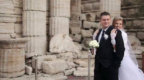 Bride embraces groom's Stock Footage 62432371