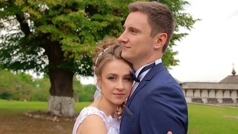The bride embraces her husband Stock Footage 75014106