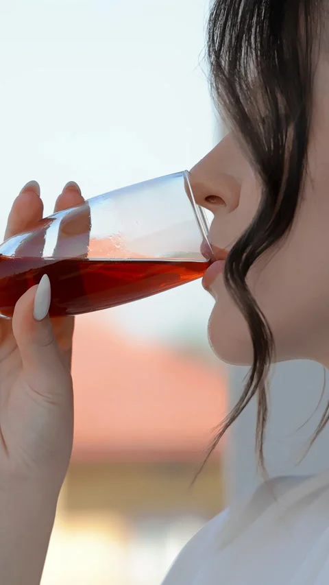 Bride enjoying a drink, elegant close-up with soft lighting and delicate details Stock Footage 307599074