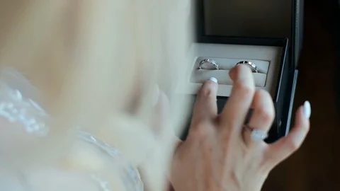 Bride Examines Wedding Rings. Stock Footage 104868035