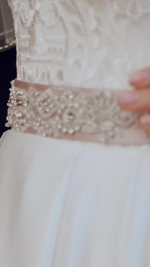 Bride fees. bride is dressed for wedding. close-up of bride's hands with gentle Stock Footage 318078660