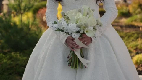 Bride With Flowers During Sunset, Romantic Outdoor Scene Of Bride With Blooming Stock-Footage 323770706