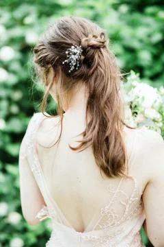 Bride with flowers in the forest Stock Photos