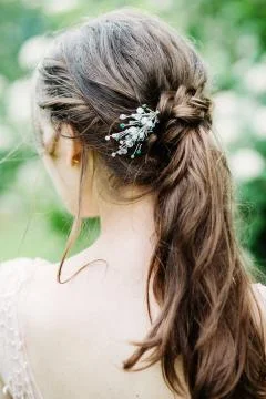 Bride with flowers in the forest 库存照片