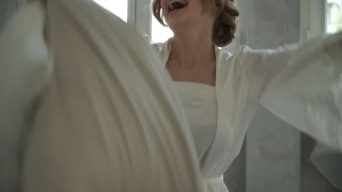 Bride fooling around in bed Stock Footage 70038654