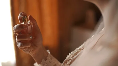 The bride gently spray perfume around his neck. The video is slower. Still shot Video stock 89047383