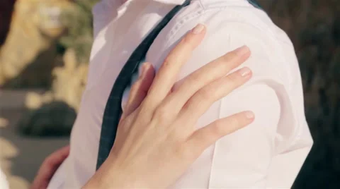 Bride gently touching groom Stock Footage 64380097