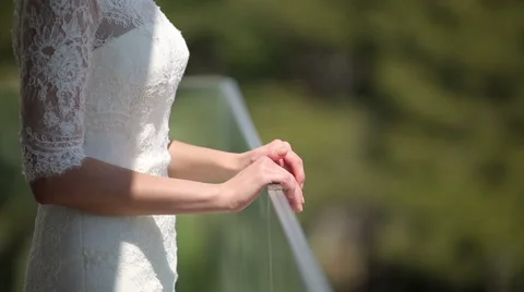 The bride gets to the balcony of the hotel Stock Footage 44563566