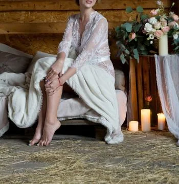 Bride is getting dressed for the wedding. Stock Photos