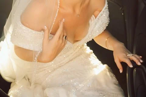 Bride getting ready in a car before wedding ceremony..bride sits in a car, ad Stock Photos