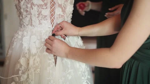Bride Getting Ready in Elegant Lace Dress With Supportive Bridesmaids Stock Footage 321717706