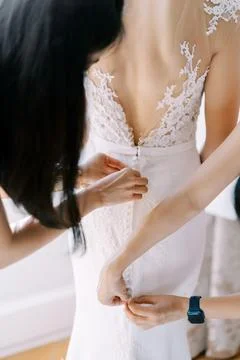 Bride Getting Ready in Elegant Lace Wedding Dress Stock Photos