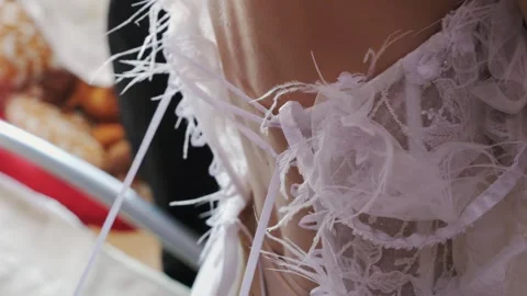 Bride Getting Ready – Wedding Dress Adjusted by Bridesmaid Stock Footage 323902453