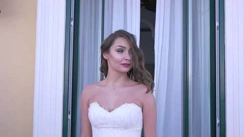 The bride goes to the balcony Stock Footage 71925375