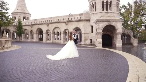 The bride goes to meet the groom. hands holding each other standing  Stock Footage 129507841