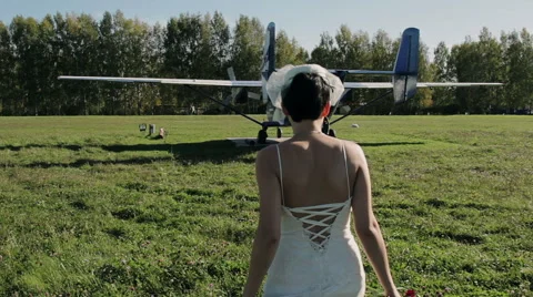 Bride goes to the old aircraft Stock Footage 55799541