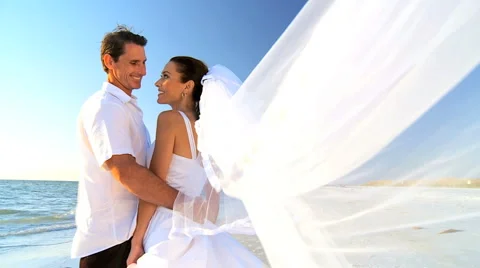 Bride &amp; Groom on the Beach Stock Footage 988081