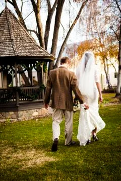 Bride &amp; Groom Walking Stock Photos