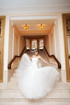 Bride in hall with staircase Stock Photos
