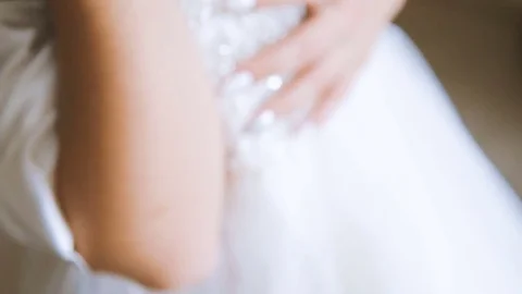 Bride hand stroking dress Stock Footage 72192087
