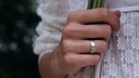 Bride Hand Wedding Ring Hold Bouquet White Dress Video stock 69749091