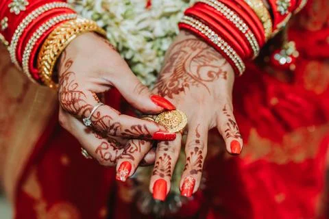Bride Hands with mehendi and bangles Stock Photos