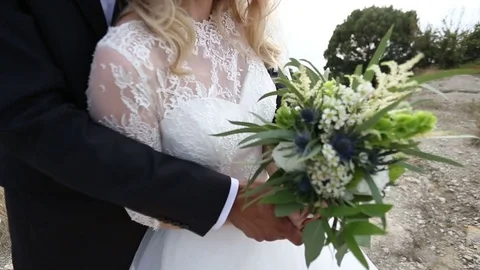 The bride has a bouquet in her hands. wedding in the style of Boho, rustic. Stock Footage 81717899