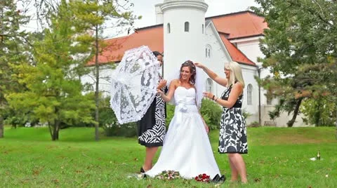 Bride with her girlfriends in a garden Stock Footage 24673112
