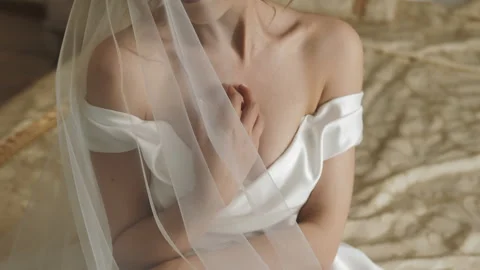 The bride in her hand on her shoulder close-up. Preparation of the bride Stock Footage 217739664