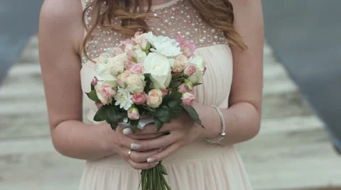 Bride hold the wedding bouquet in her hands Stock Footage 64056550