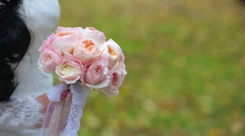 The bride is holding a bouquet of peonies Stock Footage 59045853