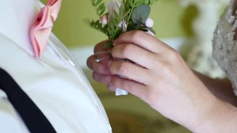 Bride holding boutonier Stock Footage 82954876