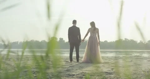 Bride is holding her husband's hand Stock Footage 99424235