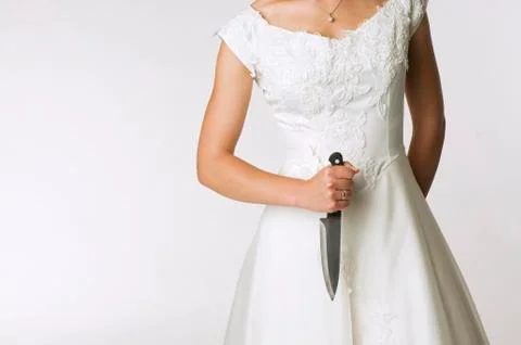 Bride holding knife, mid section Stock Photos