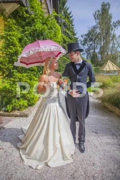 Bride is holding a pink umbrella Stock Photos