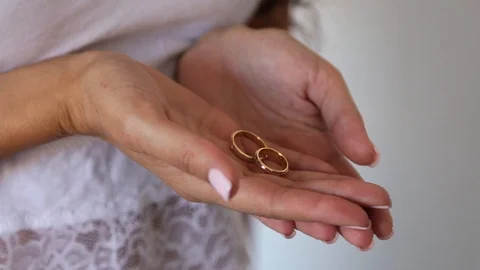 Bride holding wedding rings Stock Footage 102048897
