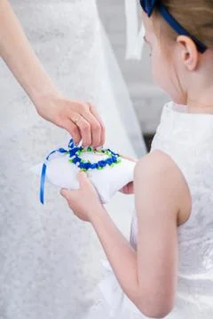 Bride holding wedding rings Stock Photos