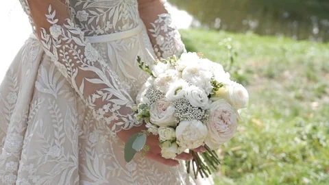 Bride holds a bouquet 스톡 동영상 130054535