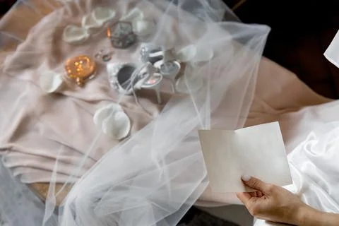 The bride holds in her hands an empty sheet for the wedding vow Stock Photos
