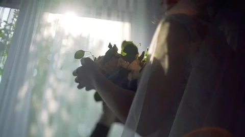 Bride holds wedding bouquet in Hands while staying on the backround of the Stock Footage 80610107