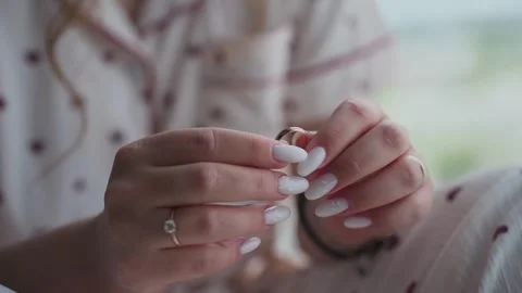 The bride holds a wedding ring in her hands Stock Footage 329092261
