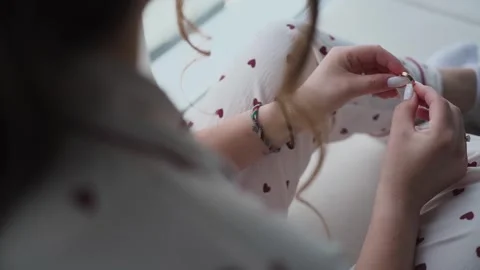 The bride holds a wedding ring in her hands Stock Footage 329092271