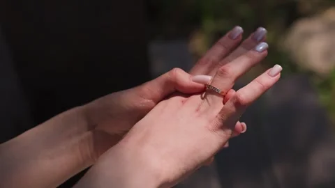 The bride holds a wedding ring in her hands Stock Footage 329092368